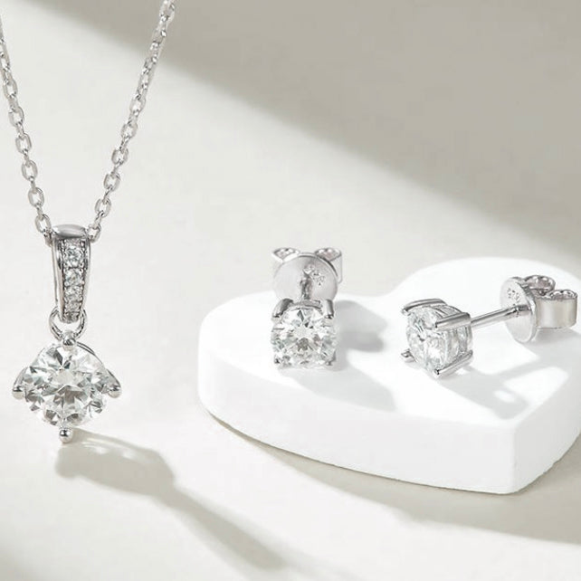 4 prong round brilliant moisannite necklace and stud earrings